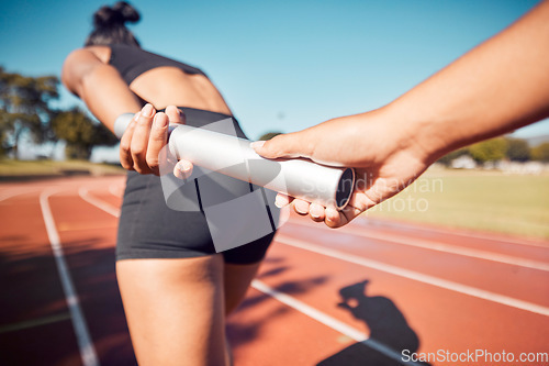 Image of Fitness, woman and hands on baton for relay sports, training or running competition on the stadium track. Active female in athletics sport holding bar for competitive race, sprint or team marathon