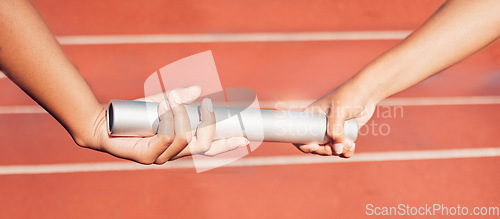 Image of Hands, baton and relay with a sports woman and partner running a race with teamwork on a track. Fitness, health and exercise with a female athlete team racing in an athletics arena for competition