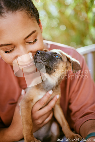 Image of Love, care and pet dog with black woman in garden for bond, affection and happiness together. Wellness, calm and healthy adoption puppy bonding embrace with happy girl owner in backyard.