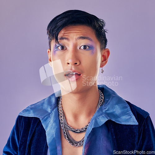 Image of Punk, makeup and face in shock, wow and surprise with a gay man on a purple studio background for future or retro fashion. Cosmetics, cyberpunk and lgbtq aesthetic model for vaporwave portrait