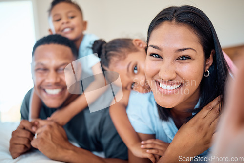 Image of Family selfie, children and bonding in bedroom of house, home or hotel in trust, love or security pov. Portrait, smile or happy mother, father and kids in photography for social media profile picture