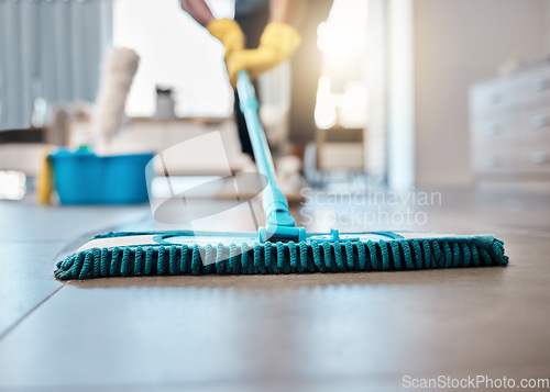 Image of Man, mopping or cleaning floor in house, home or hospitality hotel for housekeeping product service, maid or worker. Zoom, cleaner or bacteria spring clean, hygiene health or living room maintenance