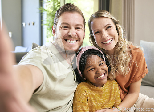 Image of Happy family, adoption and smile for selfie love, relax or bonding in happiness together at home. Mother, father and adopted child smiling or relaxing for photo moment or capture on living room couch