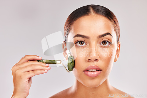 Image of Beauty, skincare and jade roller with portrait of woman for facial massage, self care and spa wellness mockup. Cosmetics, health and dermatology with girl model for cosmetology, youth and luxury