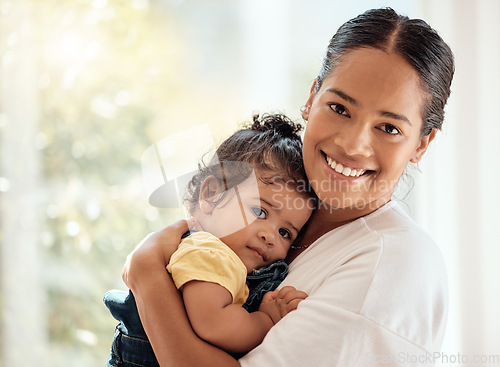 Image of Mother, baby girl or bonding hug in house bedroom or home living room in safety, love and security or support, care or protection. Smile portrait, woman or happy mom with child, toddler and cute kid