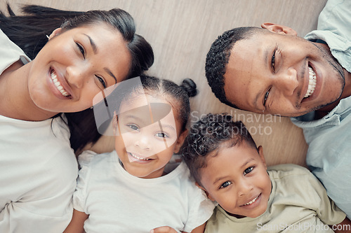 Image of Top view, floor and portrait of black family in home with happiness, love and smile on faces. Holiday, children and overhead of mom and dad with kids bonding, have fun and spend quality time together