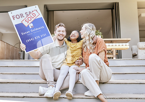 Image of Family, buy house and sold sign with a smile about property and new real estate sale. Portrait of a moving poster of a diverse father, child and adopted girl feeling happy about mortgage together