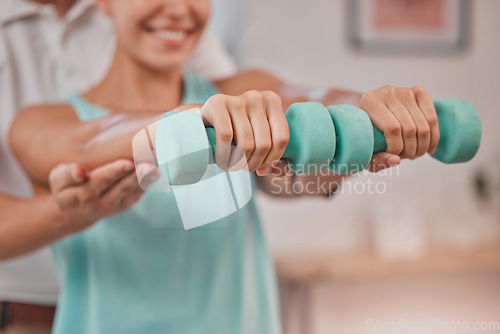 Image of Rehabilitation, physiotherapy and weights of a woman patient in a healthcare clinic consultation. Doctor, hospital and physio arms treatment of a chiropractor for medical consulting and hands health
