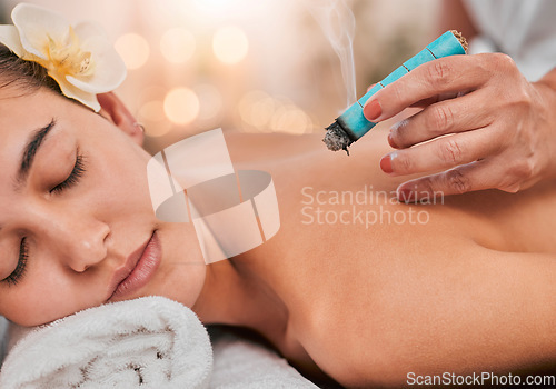Image of Physical therapy, aromatherapy and spa woman in healing, healthcare and wellness treatment for body care and relax massage. Sleeping client or patient with moxibustion smoke therapy of expert hands