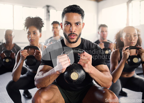 Image of Squat, kettlebell and fitness coach in a gym exercise, power and workout wellness class. Portrait of a sport personal trainer with focus on training people for health goals and sports cardio