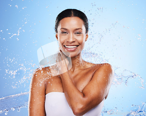 Image of Shower, water and black woman in splash and clean portrait with grooming and hygiene against blue studio background. Wet, water droplets and fresh with skincare, body care and hydration mock up.
