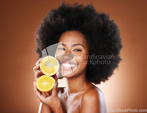 Image of Skincare, beauty and portrait of model with lemon for wellness, organic facial treatment or natural vitamin c detox. Citrus fruit product, self care routine and face of black woman with glowing skin