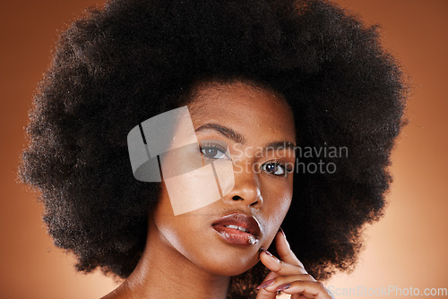 Image of Black woman, face and skincare beauty or hair care aesthetic for cosmetics wellness. Afro, african girl and model portrait for self care makeup or skin glow dermatology in orange background studio