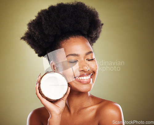 Image of Beauty, skincare and smile with black woman and coconut for moistuize, rejuvenation or tropical. Antioxidants, natural and vitamins with luxury girl model for nutrition, diet or organic treatment