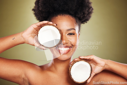 Image of Skincare, beauty and portrait of model with coconut for glowing skin hydration, body care or anti aging. Diy exfoliate, antioxidants and black woman face with fruit product for natural acne treatment