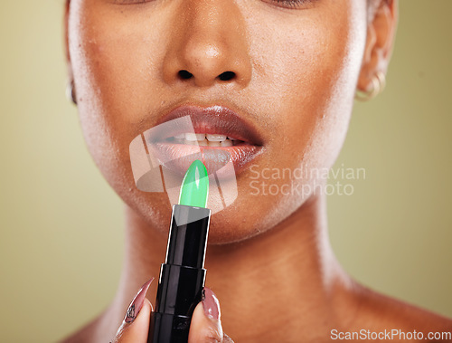 Image of Black woman, lipstick and mouth makeup, cosmetics and zoom in of lips, skincare and beauty in studio background. Advertising, skin or female model with lip gloss, makeup cosmetic and color product