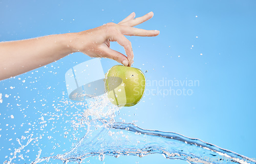 Image of Apple, water splash and hands of health woman with organic product for healthy lifestyle, antioxidants or fruit detox. Clean natural diet, nutritionist and girl with weight loss food for body care