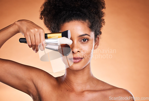 Image of Beauty, makeup and portrait of black woman with brush for cosmetics, foundation application and skincare. Wellness, healthcare and aesthetic face of model with designer product for facial routine