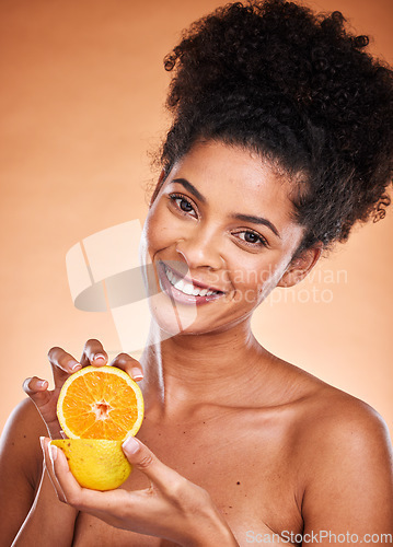 Image of Black woman, afro hair and orange fruit on studio background for vitamin c skincare, dermatology or blemish treatment. Portrait, smile or happy beauty model with citrus health food for wellness diet