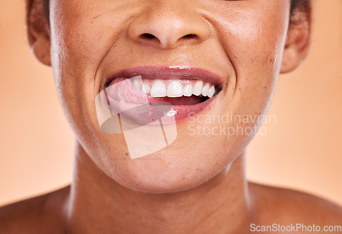 Image of Woman, mouth and smile with teeth for dental care, cosmetics or surgery against a studio background. Female smiling in satisfaction for medical tooth, oral or gum care wellness and treatment