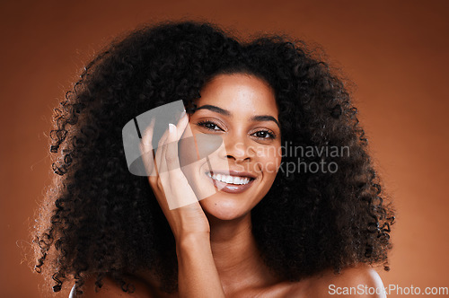 Image of Wellness, skincare and hair care portrait of black woman with happy face touching texture. Health, beauty and natural african cosmetic model on brown studio background with beautiful smile.