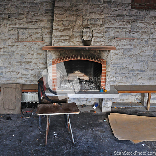 Image of dirty fireplace in abandoned interior