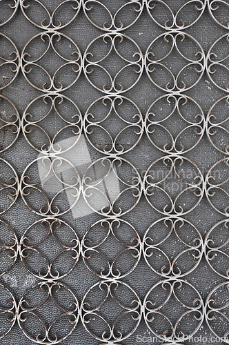 Image of vintage iron door with circles pattern