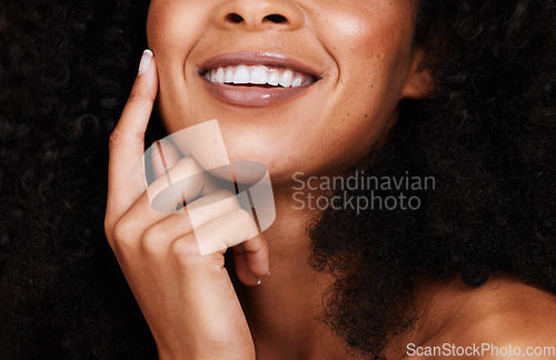 Image of Black woman, smile and touch face with natural beauty, pride and confident with curly hair. Cosmetics, African American female and young lady with skincare, happy and organic facial with smooth skin