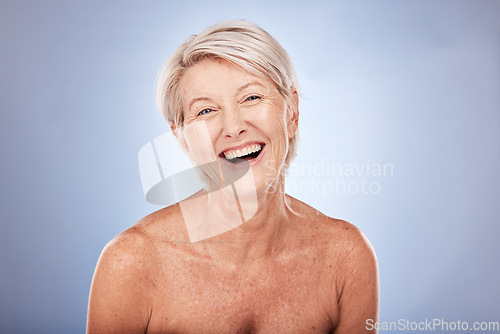 Image of Skincare, wellness and portrait of senior woman with smile in studio on blue background. Beauty, makeup and happy old woman with natural skin for antiaging beauty products, dermatology and cosmetics
