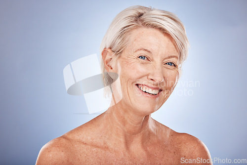 Image of Portrait, skincare and antiaging with a mature woman in studio on a gray background for natural beauty care. Face, cosmetics and wellness with a senior female posing to promote a skin product