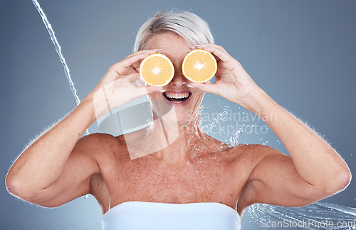 Image of Woman, water splash and lemon fruit skincare grooming for vitamin c treatment, facial blemish or dermatology cosmetology. Smile, happy or mature beauty model with citrus food or product covering eyes