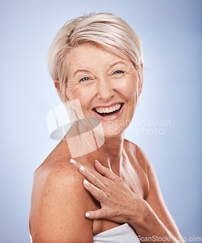 Image of Face portrait, skincare and senior woman in studio isolated on blue background. Makeup, beauty and mature female model from Canada with glowing, healthy and flawless skin after cosmetic spa treatment