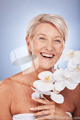 Image of Mature woman, portrait and beauty with a flower for organic or natural skincare and bodycare. Face, senior female and floral cosmetology or dermatology treatment for facial antiaging wellness