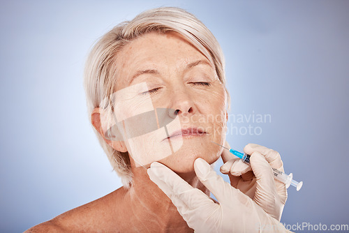 Image of Syringe, doctor hands and senior woman face for collagen, skincare and antiaging filler injection with medical cosmetics in studio. Elderly woman model and dermatology expert for plastic surgery.