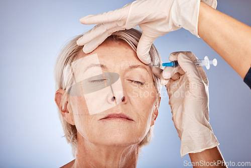 Image of Skincare, mature woman and injection from healthcare professional for anti aging treatment for wrinkles on forehead. Beauty syringe, facial wellness and a senior lady getting collagen filler injected.