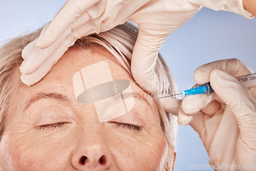 Image of Face, hand and syringe for needle, cosmetic and beauty against a grey studio back with mockup, Senior woman with plastic surgery, hands and facial for collagen, lifting and silicone injection.