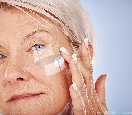 Image of Senior, skincare and face wellness cream of a woman with cosmetic, beauty and facial product. Portrait of a elderly model with sunscreen, cosmetics and collagen dermatology lotion for anti aging