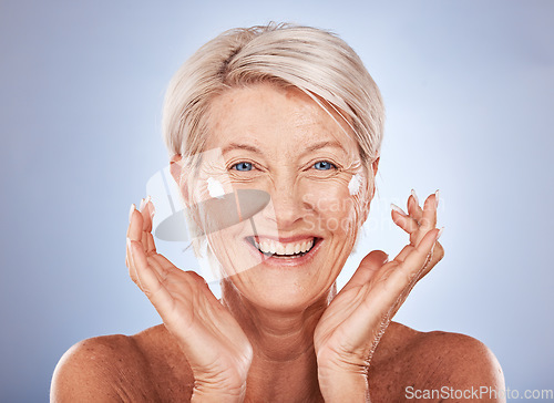 Image of Senior woman, face and skincare cream product for grooming on studio background in dermatology routine, health wellness or collagen treatment. Happy smile or elderly beauty model and sunscreen facial