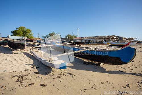 Image of Traditional wooden fishing boats on the tropical beach of Anakao, Tulear, Madagascar. Ocean view with sandy beach