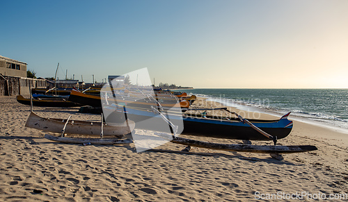Image of Traditional wooden fishing boats on the tropical beach of Anakao, Tulear, Madagascar. Ocean view with sandy beach