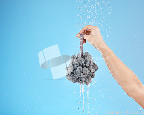 Image of Shower, water and hands of woman with loofah for daily bathroom routine, body cleaning and self care. Skincare mockup, hygiene and wet girl washing with body care product isolated on blue background