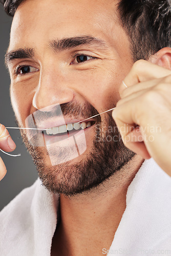 Image of Man, teeth and face smile for dental floss, skincare or cosmetics for fresh clean or healthy hygiene. Closeup of bearded male flossing toothy mouth for oral, dermatology or gum care treatment