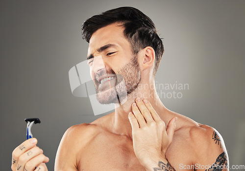 Image of Man, face and shaving pain on neck for skincare beauty or cosmetics wellness in studio. Facial care, hygiene dermatology grooming acciedent and shave beard for skin healthcare against grey background