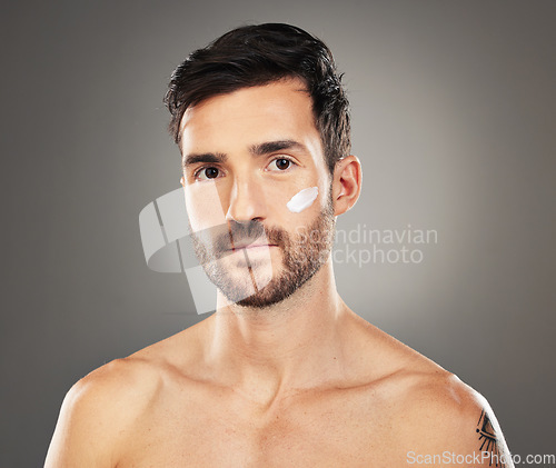 Image of Face cream, skincare and beauty portrait of man in studio isolated on gray background. Wellness, health and male model from Canada with facial creme, moisturizer or cosmetics product for healthy skin