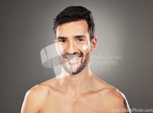 Image of Cream, skincare and man, facial sunscreen and makeup product, beauty and health, wellness and clean skin on studio background. Portrait of happy guy, face cream and spf lotion cosmetics for body care