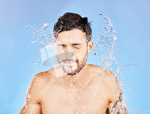 Image of Water splash, shower and man cleaning, skincare and. washing body, face and beauty in blue stuck mockup background. Male model, clean, and hygiene care, fresh and wash skin for health and wellness