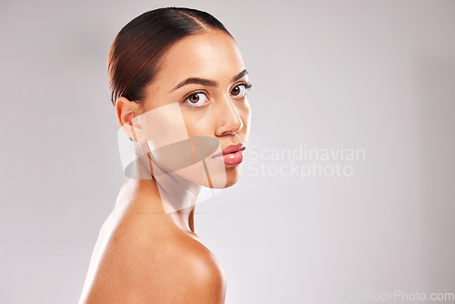 Image of Skincare, body and serious woman beauty portrait for natural cosmetic marketing with confident and assertive face. Health, wellness and glowing skin advertising model with gray studio mockup.