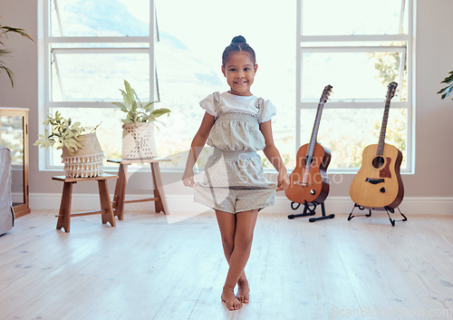 Image of Girl, dance and ballet in home portrait for training, lesson or class in music room for happy curtsy, female child or dancer in art, dancing or happiness for creative kid in house with smile on face