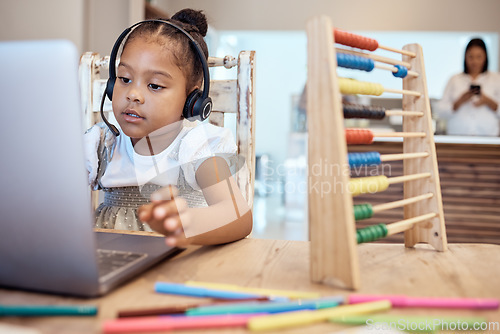 Image of Girl, laptop and learning in home for education, development or study in home with toys, pen or tech. Child, computer and digital home school with video conference, video call or elearning classroom