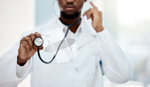 Image of Black man doctor, stethoscope in hand and health with medical and check up in hospital. Healthcare, health insurance and professional in medicine, surgeon listening to heartbeat and cardiology.